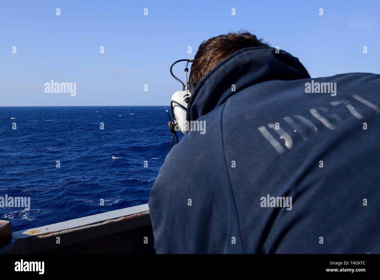 SEA (March 24, 2019) - Seaman Robert Collins uses an alidade aboard the ...