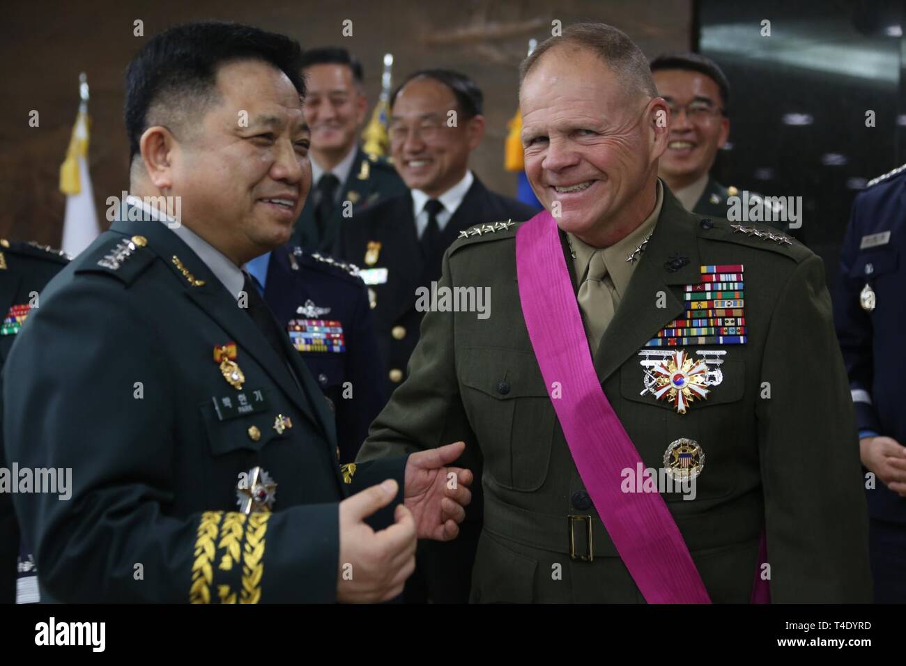 Commandant of the Marine Corps Gen. Robert B. Neller laughs with Republic of Korea Chairman of the Joint Chiefs of Staff, Gen. Park, Han-ki after a ceremony in Yongsan, South Korea, March 28, 2019. Gen. Neller received the Order of National Security Merit in recognition of the partnership between U.S and Korean military forces. Stock Photo