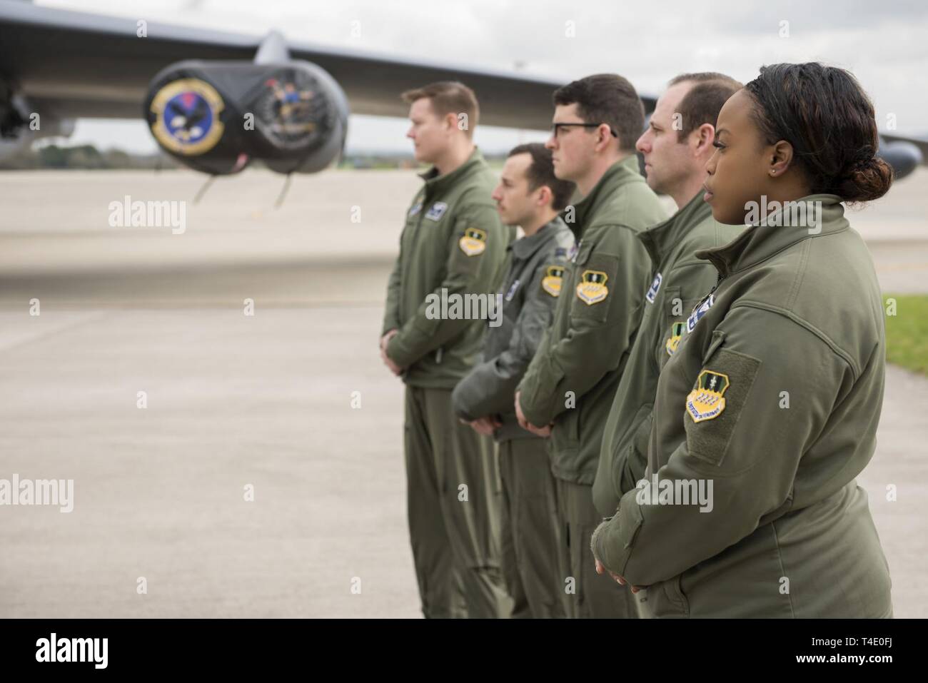 U.S. Air Force Capt. Austyn Wilson (right), 20th Bomb Squadron weapons system officer deployed from Barksdale Air Force Base, La., and other members of the 20th BS pose during a press conference at RAF Fairford, March 19, 2019, regarding a Bomber Task Force Europe deployment. The contingent of B-52 aircraft, Airmen and support equipment are currently deployed from the 2nd Bomb Wing, Barksdale Air Force Base, La., to support the BTF. The deployment of strategic bombers to the U.K. helps exercise RAF Fairford as U.S. Air Forces in Europe - Air Forces Africa’s forward-operating location for bombe Stock Photo