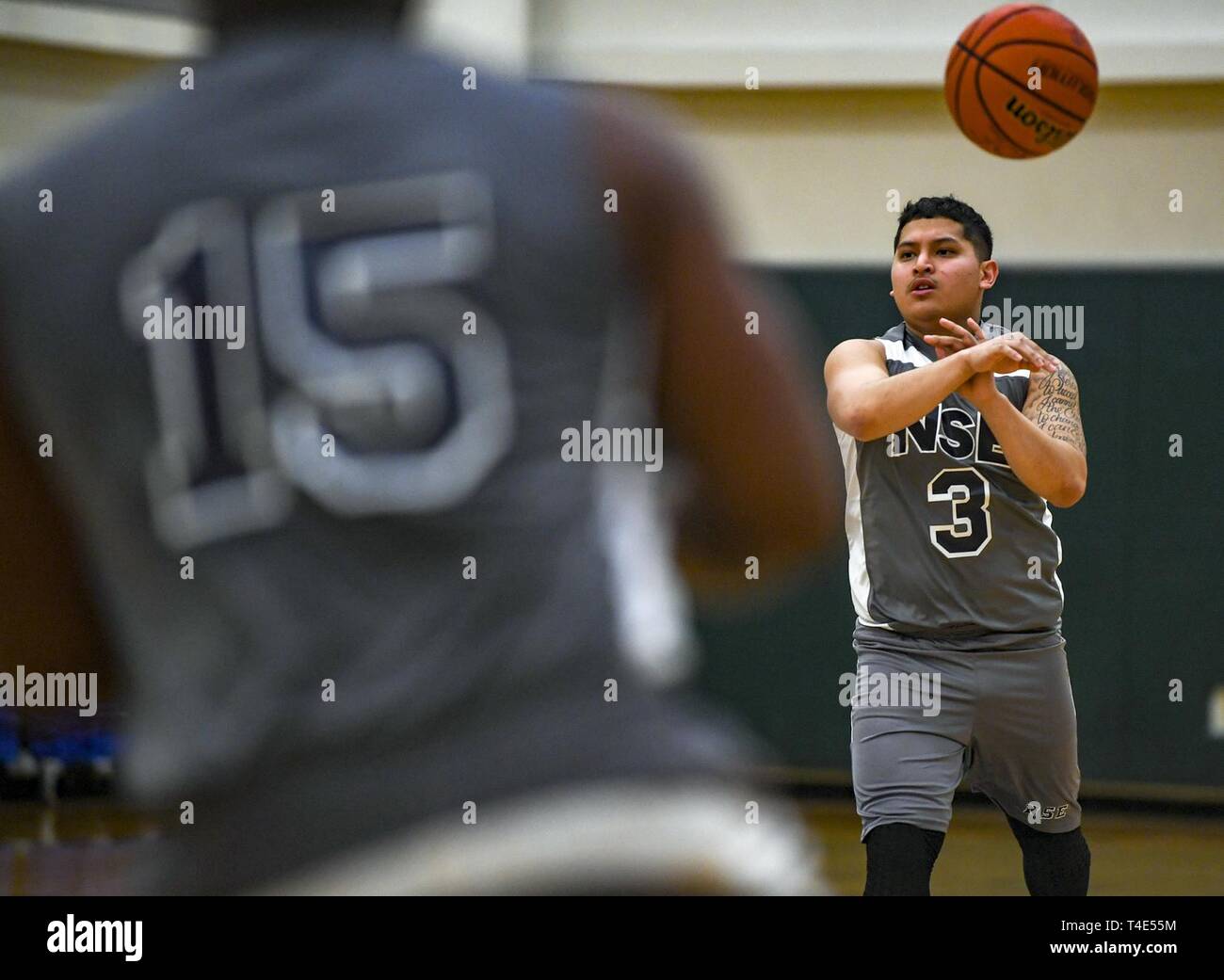 EVERETT, Wash. (March 30, 2019) MasteratArms 3rd Class Louis Gasca passes the ball to a