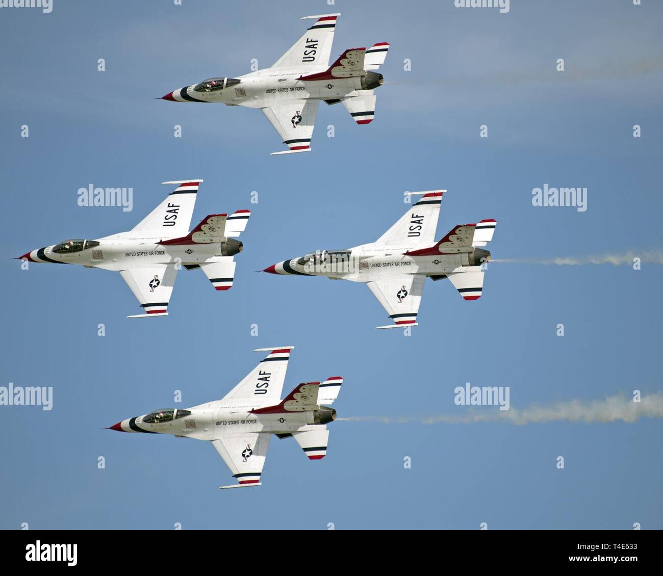 The USAF Thunderbirds demonstration team perform during the “Thunder over the Bay” Air Show, Travis Air Force Base, California, March 31, 2019. In addition to the U.S. Air Force Thunderbirds aerial demonstration team, the two-day event featured performances by the U.S. Army Golden Knights parachute team, flyovers, and static displays. The event honored hometown heroes like police officers, firefighters, nurses, teachers and ordinary citizens whose selfless work made their communities safer and enhanced the quality of life. Stock Photo