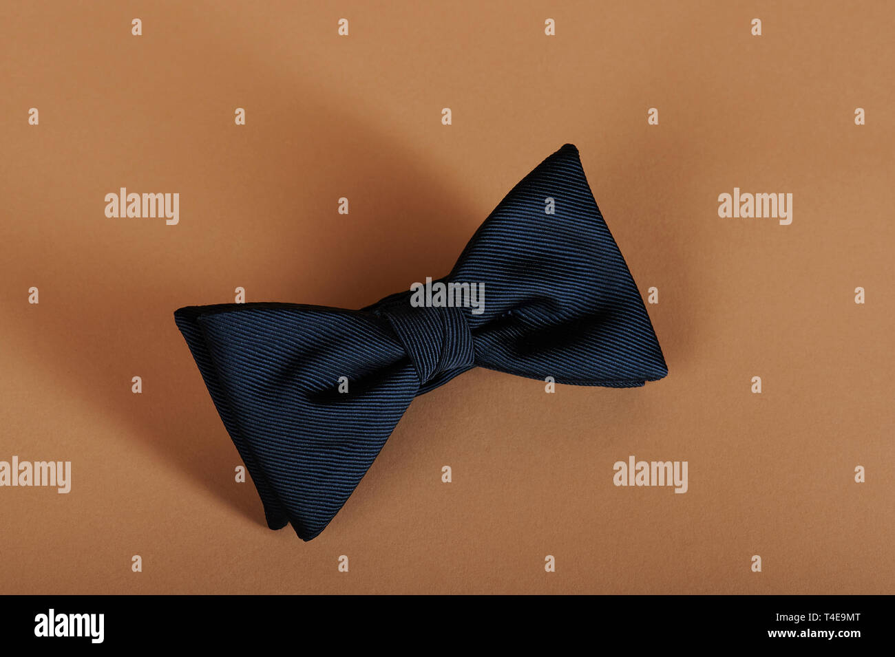 Classic dark blue bow tie close up view Stock Photo