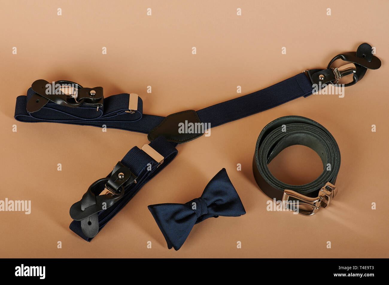 Set of men accessories, bow tie, suspenders and black belt Stock Photo
