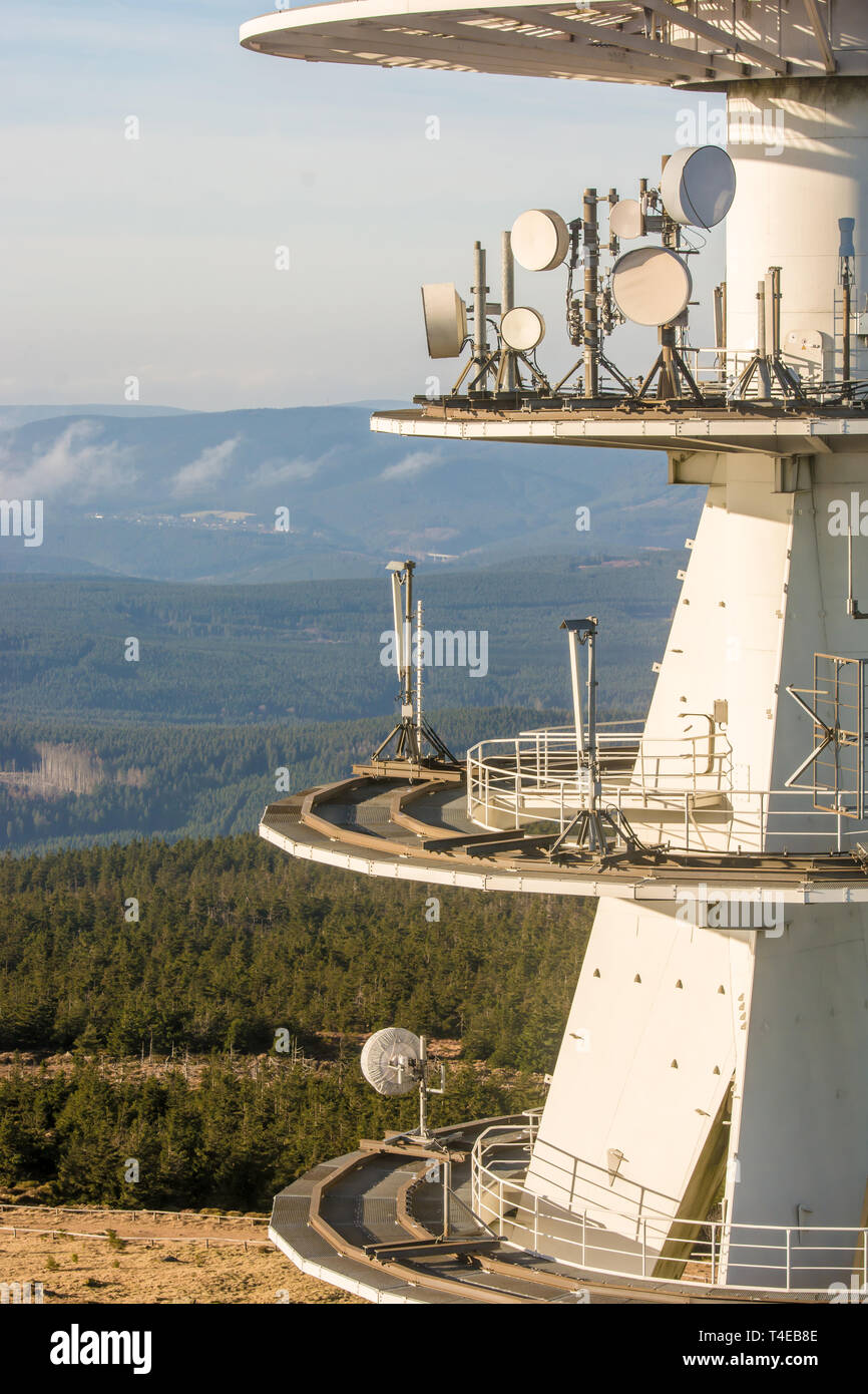 Transmission mast in detail with wooded area in the background Stock Photo