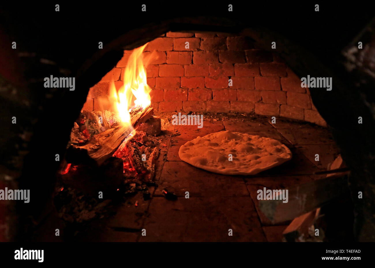 Pizza Dough Being Baked in the Wood Fired Pizza Oven Stock Photo Alamy