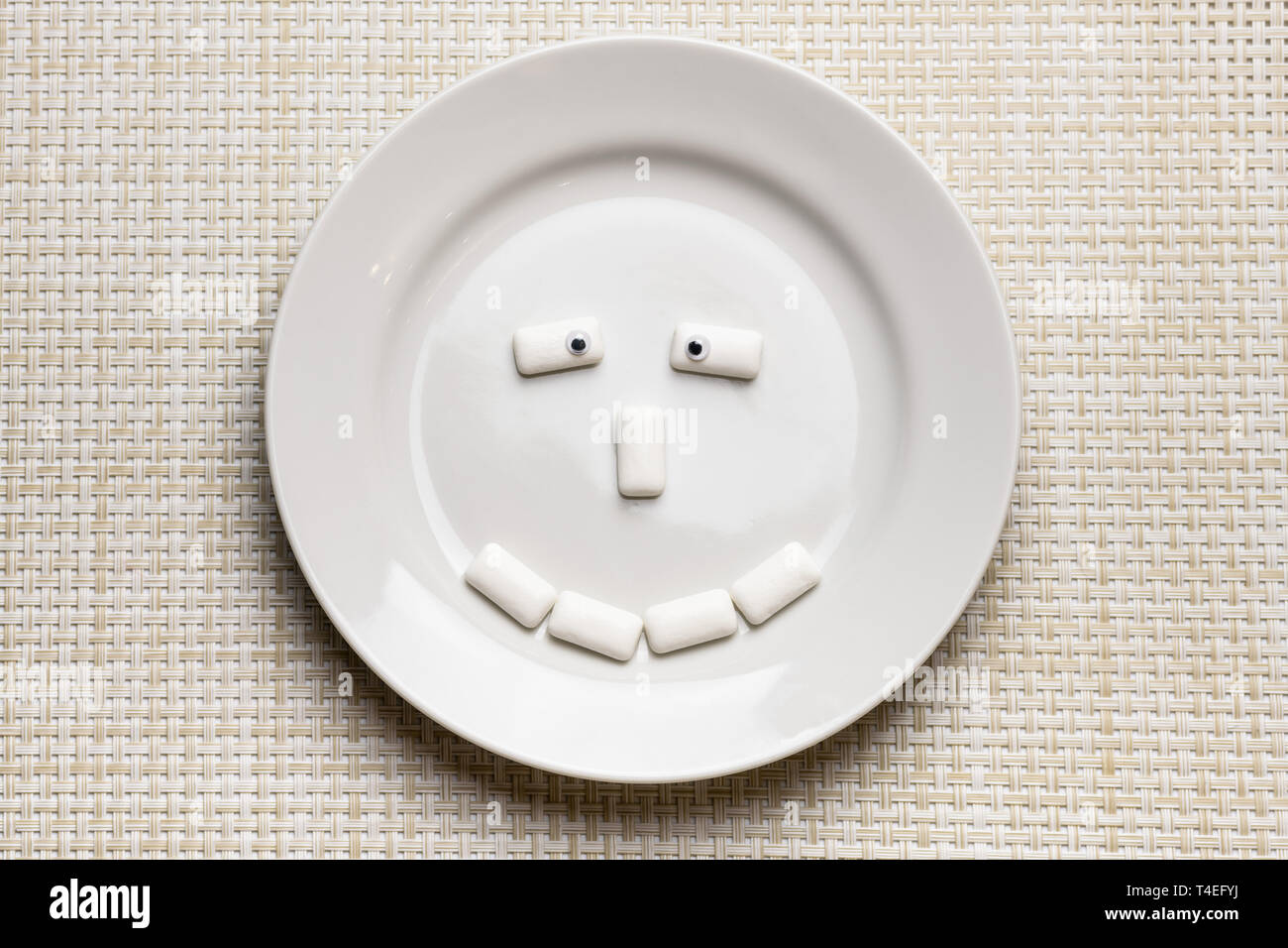 Chewing gum shaped funny face. Oral hygiene and protect teeth from