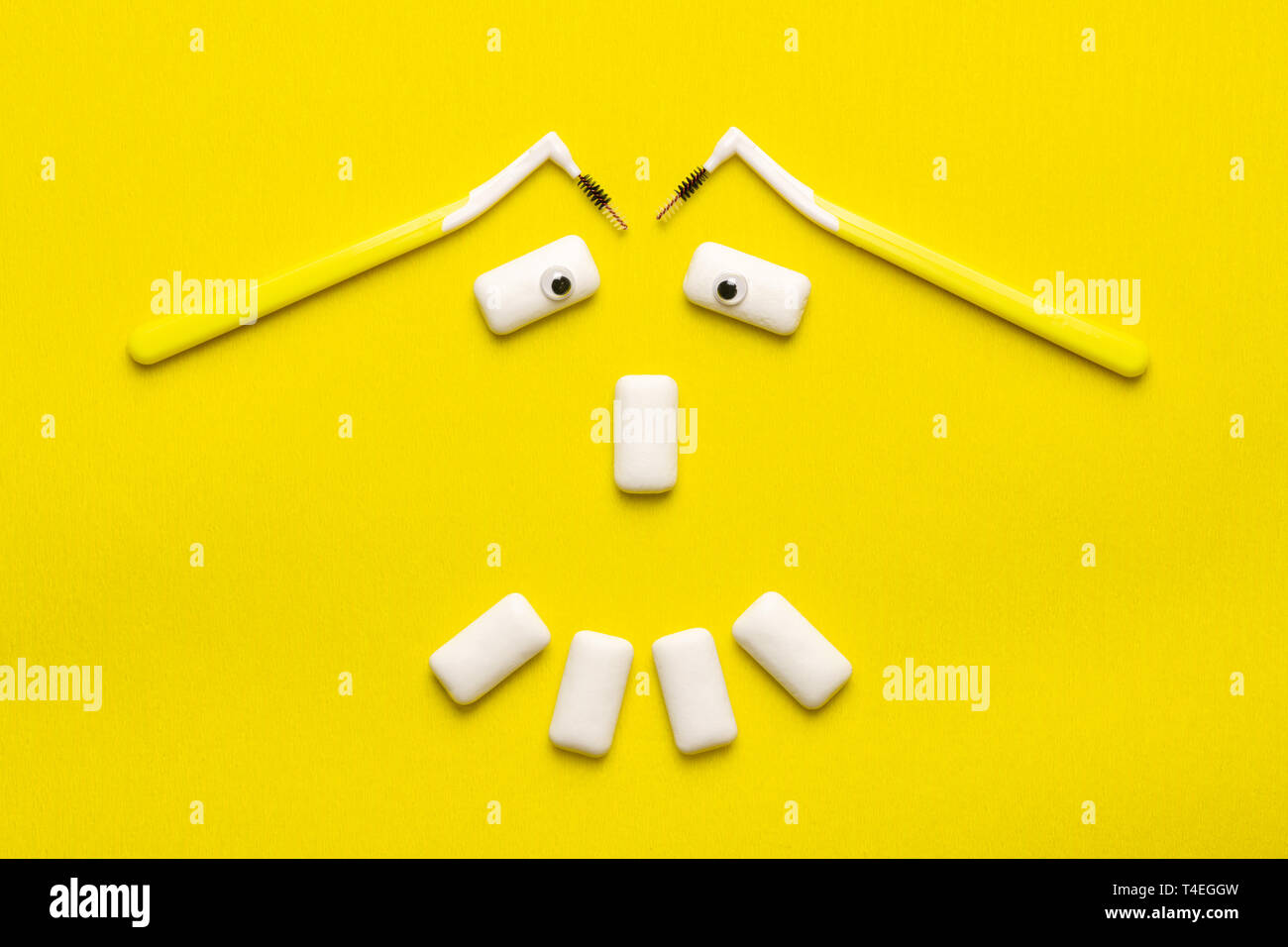Braces cleaning concept with funny smile face shaped chewing gums pads