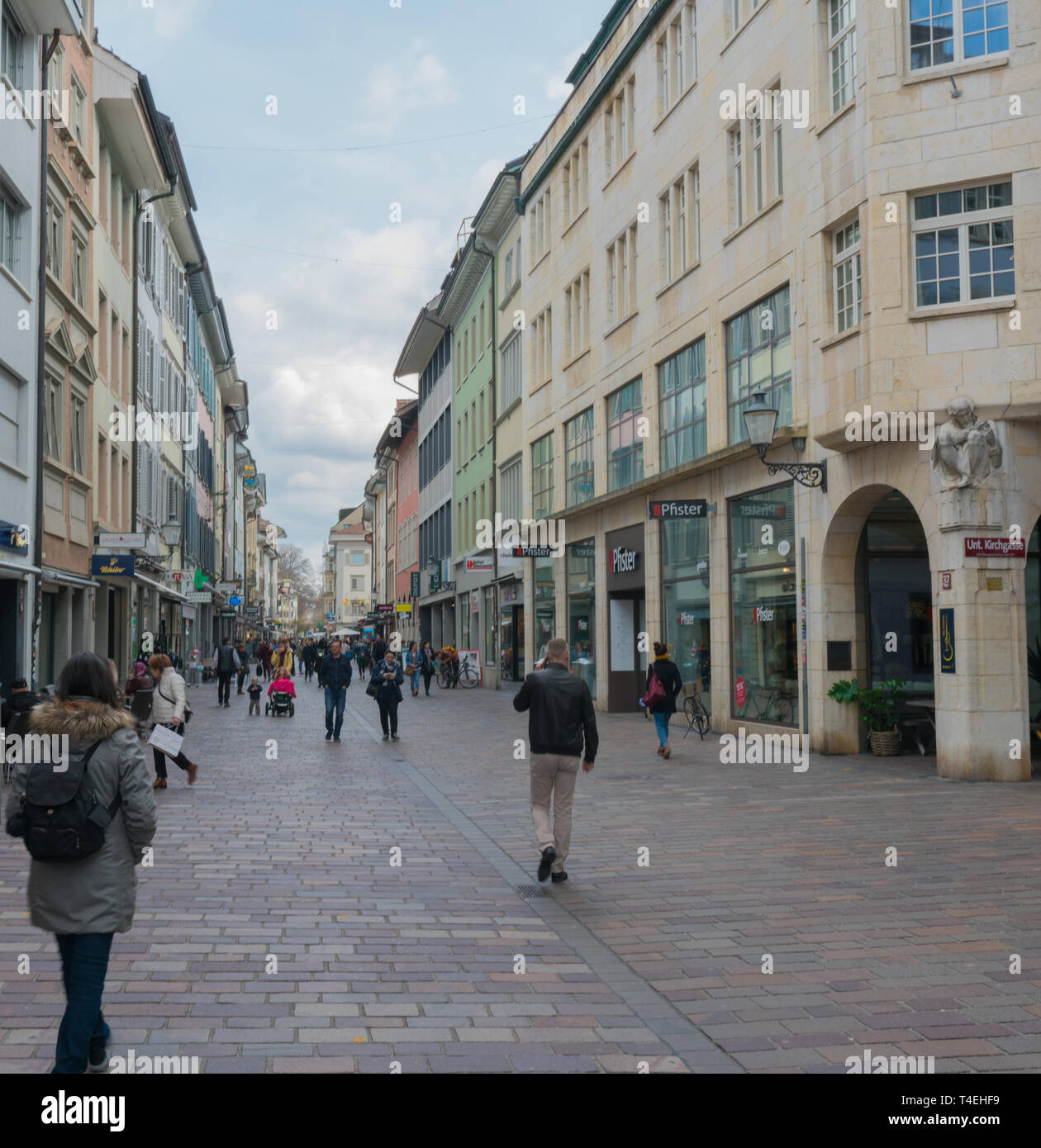 Winterthur, ZH / Switzerland - April 8, 2019: the hustle and bustle of the historic Marktgasse street in old town Winterthur with people running erran Stock Photo