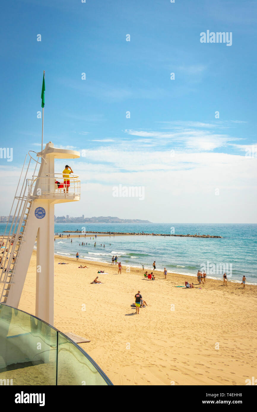 spanish lifeguard stands on lookout tower in front of El Postiguet Beach in Alicante Spain Stock Photo