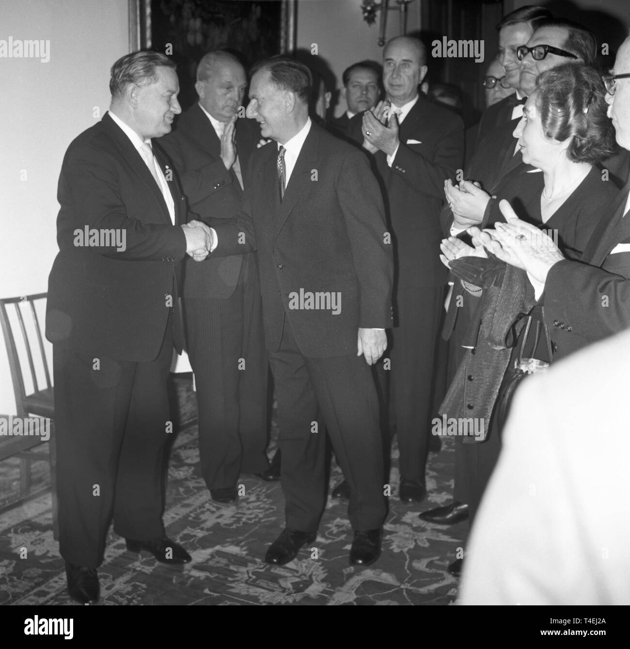 Bavarian minister president Alfons Goppel (l) welcomes the chairman of the Bavarian Journalists' Association Dr. Ernst Müller-Meiningen jr. as spokesman of the journalists (M) at the reception for the Bavarian media (undated archive picture from 1963). | usage worldwide Stock Photo