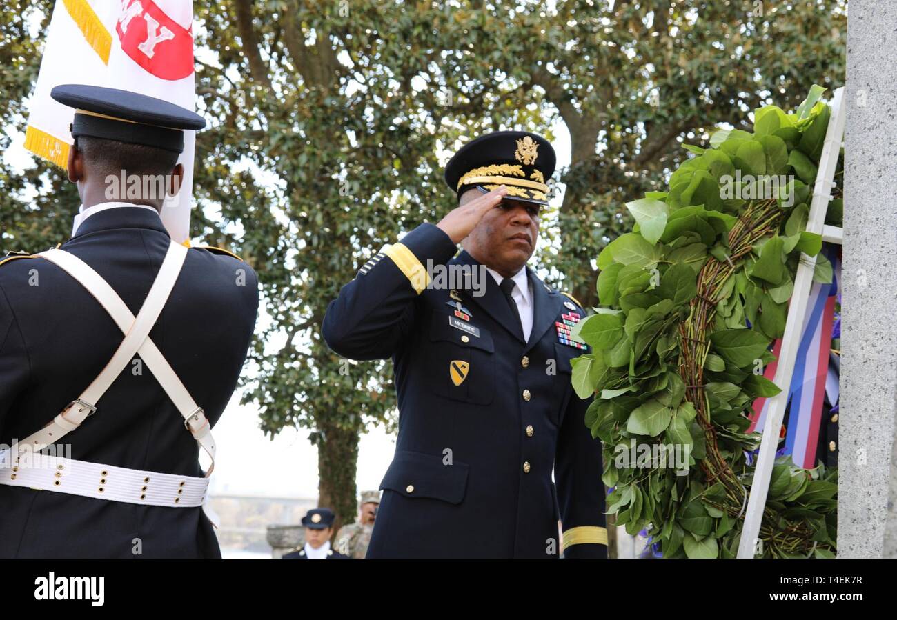 Brig. Gen. Douglas McBride, Quartermaster General, salutes during a commemoration of the