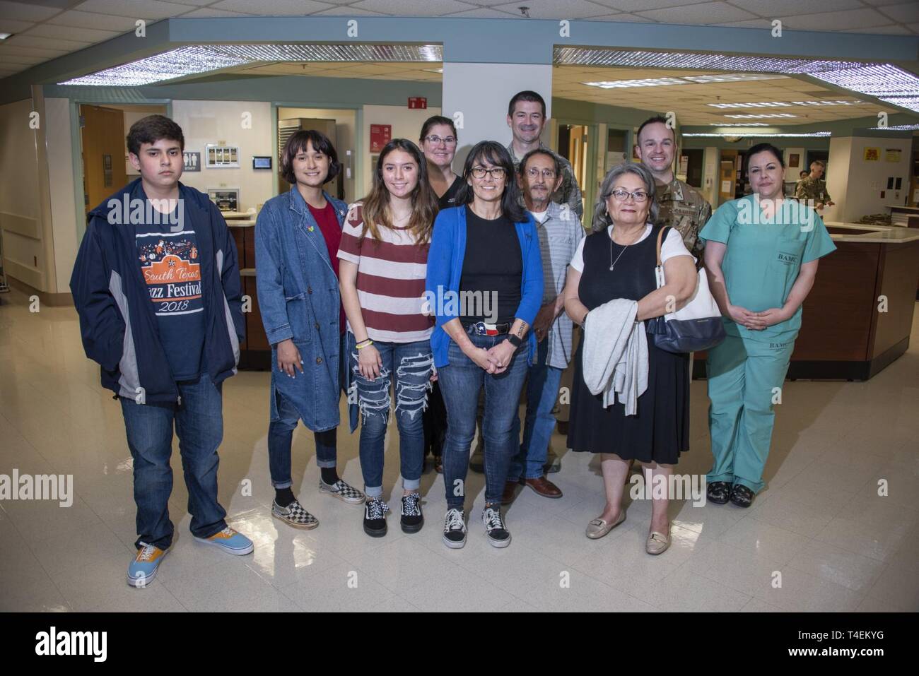 Rita Ibanez, along with her parents and children, poses for a photo with the Extracorporeal Membrane Oxygenation team at Brooke Army Medical Center, Fort Sam Houston, Texas, March 22, 2019. Ibanez and her family met with the ECMO team to thank them for the care she received while she was on ECMO for two weeks in 2015. Stock Photo