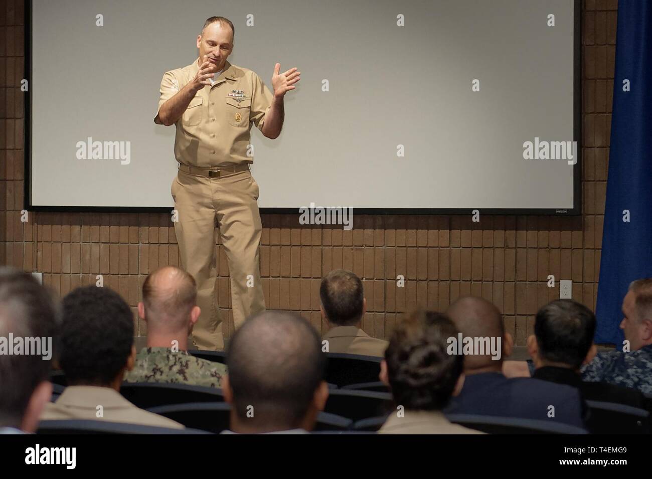 Navy Medicine West (NMW) Command Master Chief Loren Rucker, speaks to staff during an all hands