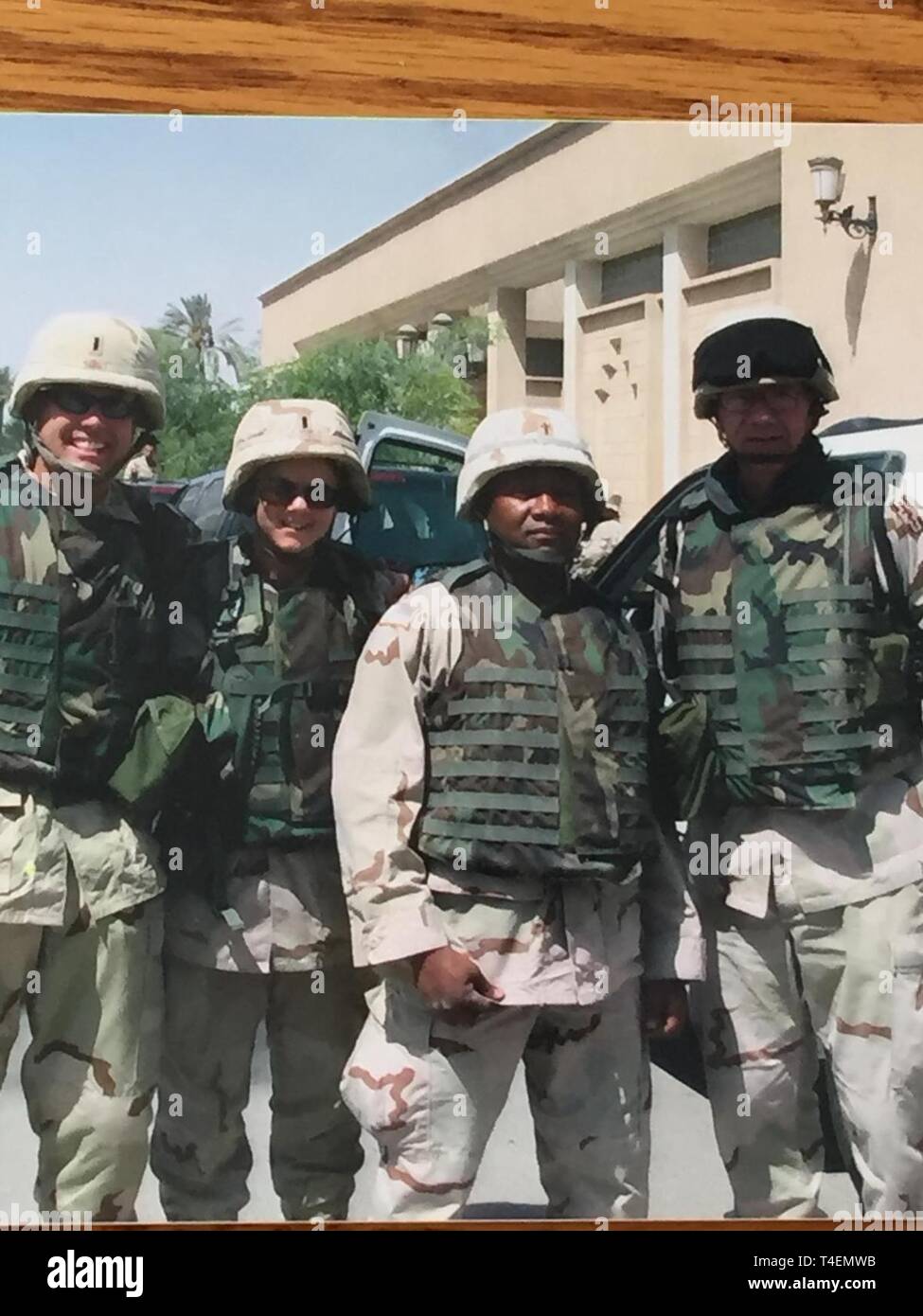During Operation Iraqi Freedom, 1st Sgt. Charles Kampa, right, with 452nd  Combat Support Hospital, poses with members of the unit while in Iraq in  2003. Kampa is part of four generations of