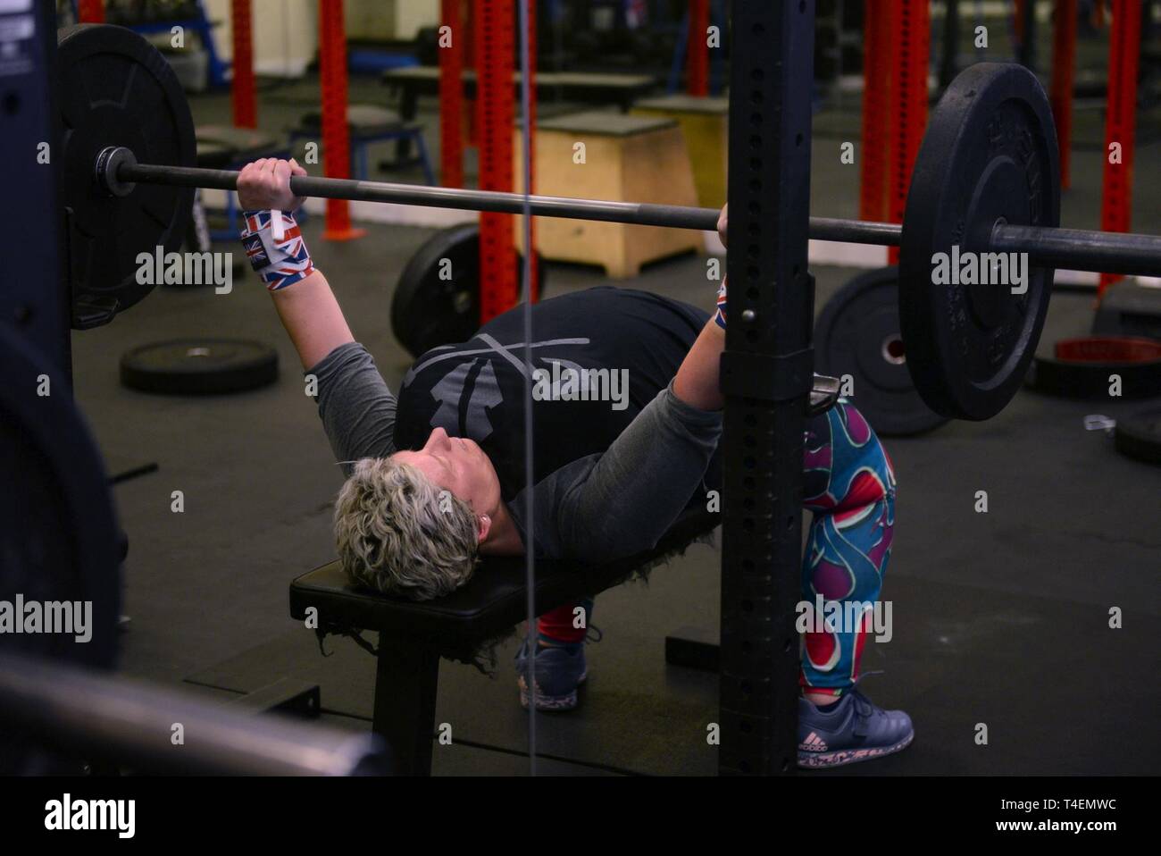 Sarah Marsden, 100th Civil Engineer Squadron environmental engineer,  performs a bench press with some light weights during a workout session on  RAF Mildenhall, England, March 26, 2019. Marsden is a champion powerlifter,