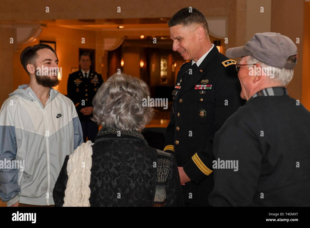 Vice Chief of Staff of the US Army Lt. Gen. Joseph M. Martin welcomes the arriving Medal of Honor family, Trevor Oliver, Jack and Elanine Atkins upon arrival to their hotel at Sheraton Pentagon City Hotel, Arlington, Va., March 24, 2019. Staff Sgt. Atkins will be posthumously awarded the Medal of Honor for actions while serving with Delta Company, 2nd Battalion, 14th Infantry Regiment, 2nd Bridgade Combat Team, 10th Mountain Division, in Abu Sarnak, Iraq, in support of Operation Iraqi Freedom, on June 1 2007. His extraordinary heroism in attempting to subdue a suicide bomber and shielding thre Stock Photo