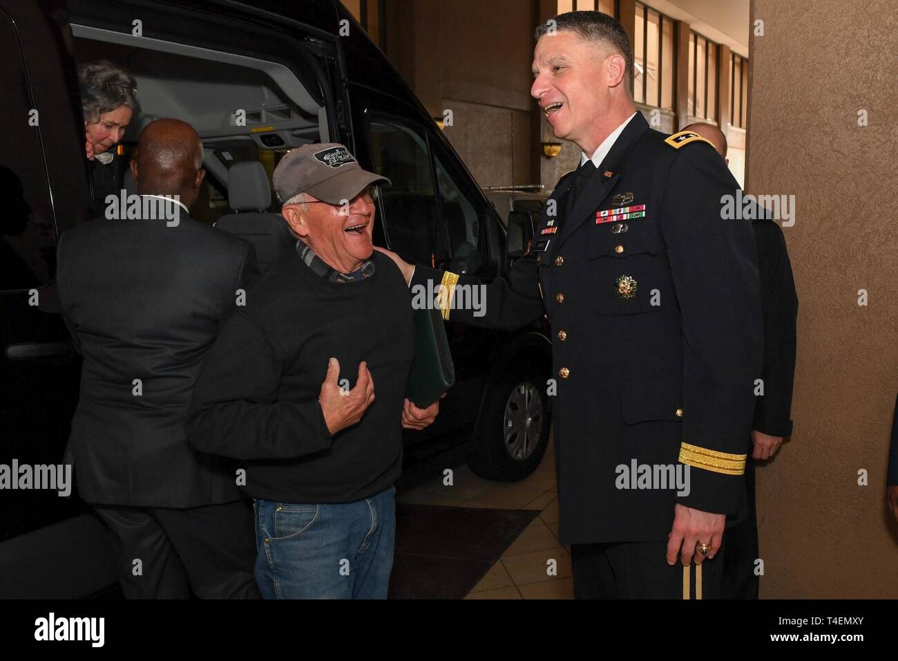 Vice Chief of Staff of the US Army Lt. Gen. Joseph M. Martin greets Trevor Oliver and Jack and Elanine Atkins, family of Staff Sgt. Travis Atkins, upon arrival at the Sheraton Pentagon City Hotel, Arlington, Va., March 24, 2019. Staff Sgt. Atkins will be posthumously awarded the Medal of Honor for actions while serving with Delta Company, 2nd Battalion, 14th Infantry Regiment, 2nd Bridgade Combat Team, 10th Mountain Division, in Abu Sarnak, Iraq, in support of Operation Iraqi Freedom, on June 1 2007. His extraordinary heroism in attempting to subdue a suicide bomber and shielding three soldier Stock Photo