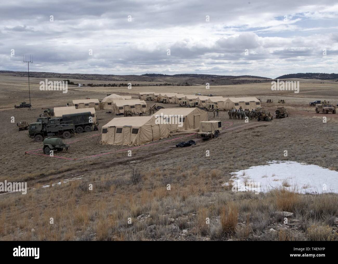 The 823d Base Defense Squadron (BDS) trains at their main operating base during the Mission Readiness Exercise (MRX) at Camp Guernsey, Wyo., March 25, 2019. During the MRX, the 823d BDS practiced adaptive basing in support of National Defense Strategy objectives. This camp was assembled within five hours. Stock Photo