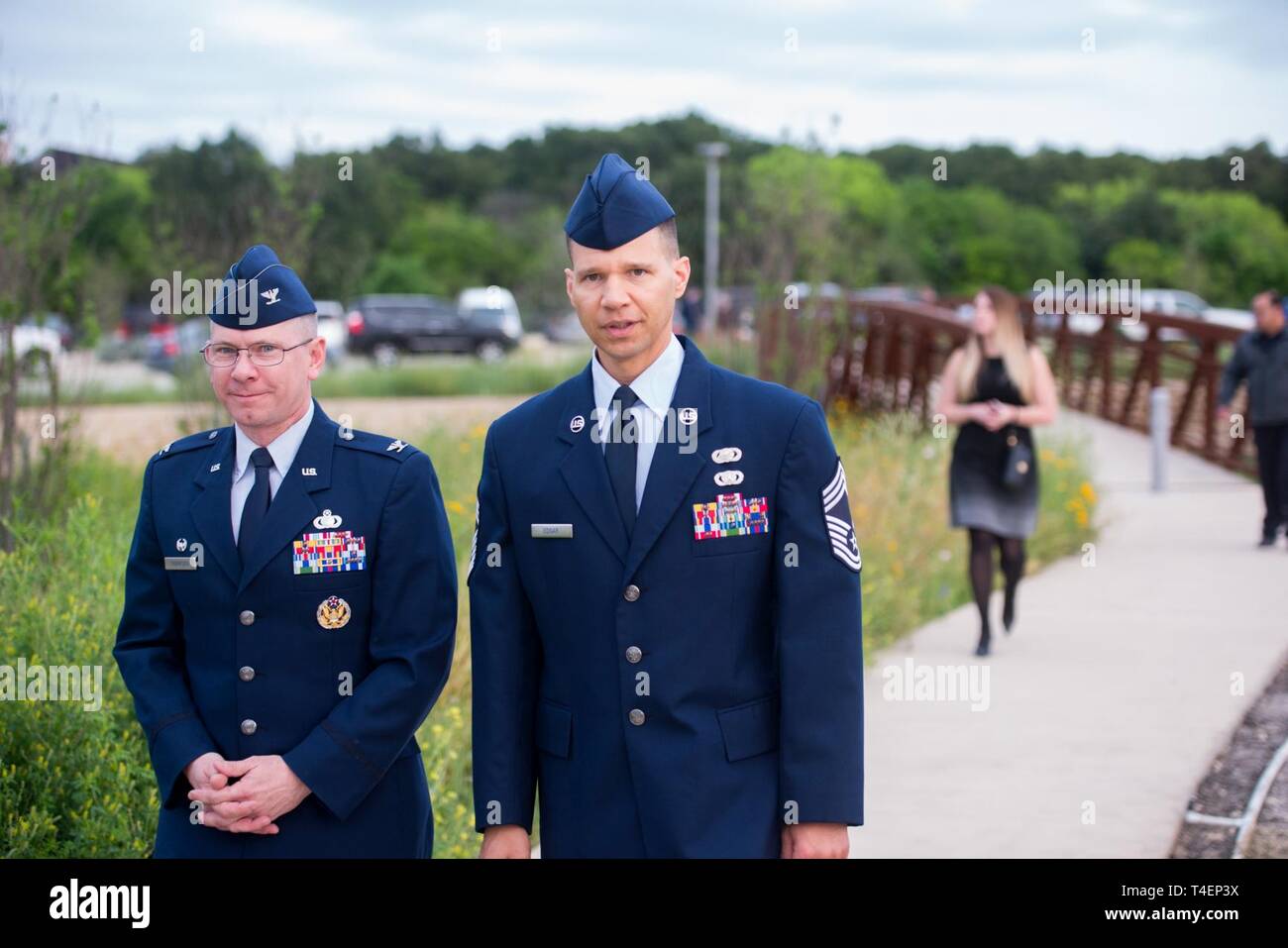 U.S. Air Force Col. Scott Thompson, 502d Installation Support Group commander, and Chief Master Sergeant Edward H. Edgar arrive at the Tribute to Freedom sculpture grand opening, Mar. 27, 2019, at the corner of U.S. Highway 90 and Military Drive. The event marked the completion of phase one of the Lackland Corridor Gateway Project. Designed by George Schroeder, the art sculpture piece includes five forms representing the five branches of the U.S. Armed Forces, with a central obelisk modeled after the Washington Monument. Stock Photo