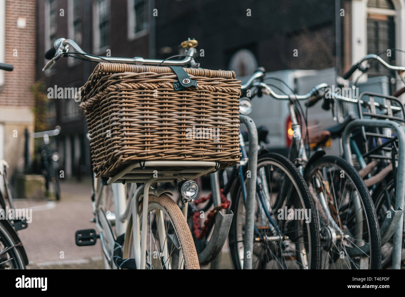 Classic bycicle with basket in Amsterdam, Europe Stock Photo Alamy