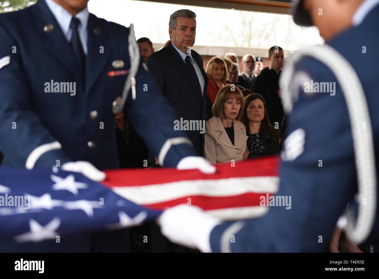 An Air Force Honor Guard team folds the American flag during the