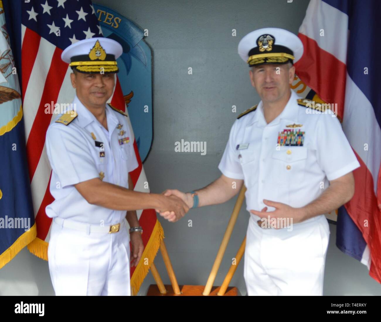 LAEM CHABANG, Thailand (April 4, 2019) Deputy Commander, U.S. 7th Fleet, Rear Adm. Ted LeClair greets Deputy Director General, Royal Thai Navy, Somchat Sata aboard the U.S. 7th Fleet flagship USS Blue Ridge (LCC 19). The 7th Fleet intent for the exchange is to increase Theater Security Cooperation through the facilitation of bilateral and multilateral military exchanges and dialogue. Stock Photo