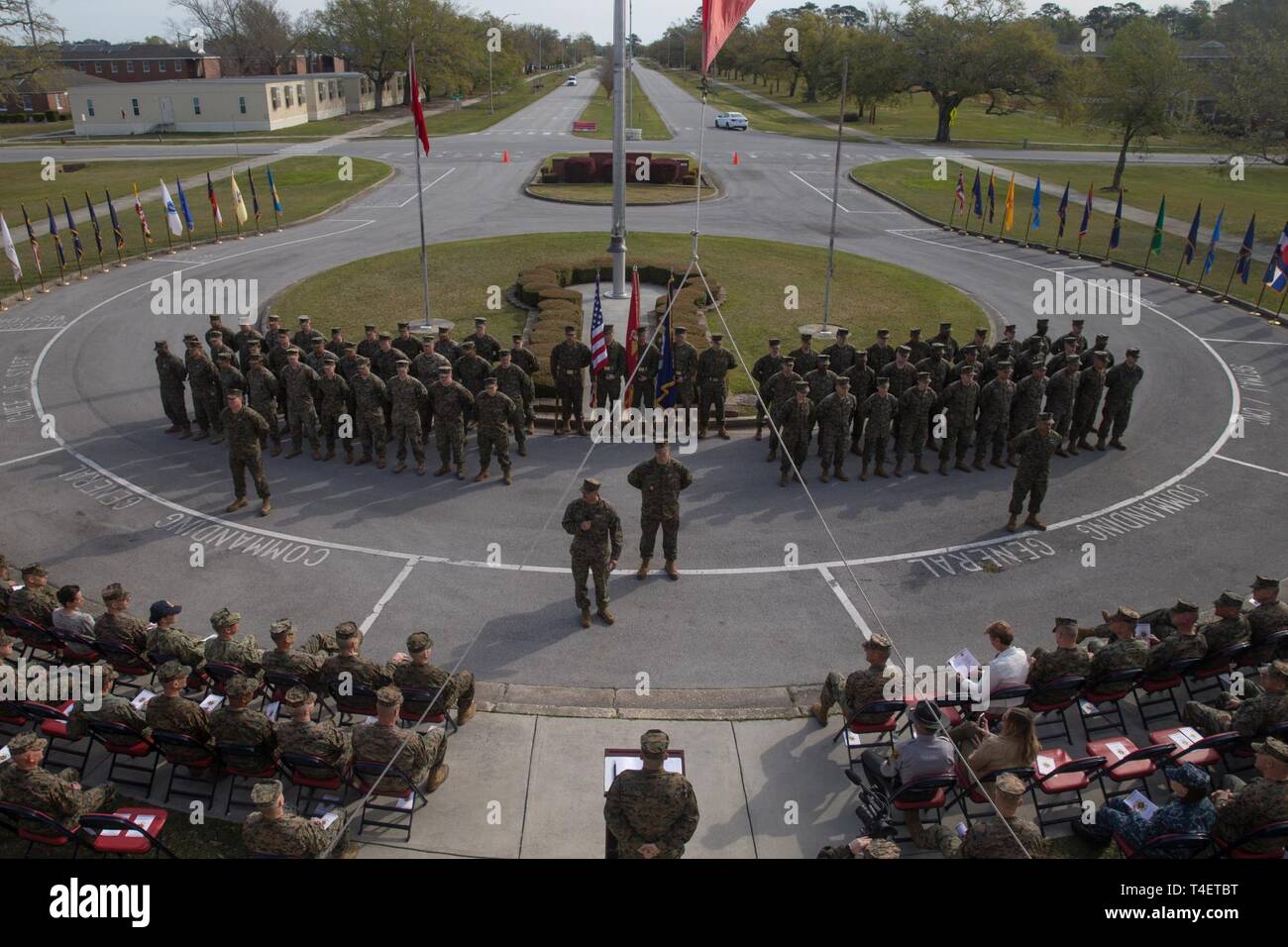 U.S. Sailors with 2nd Marine Logistics Group (MLG) stand in formation during a change of charge ceremony at Camp Lejeune, North Carolina, April 4, 2019.  Master Chief Petty Officer Christopher Rebana was relieved by Master Chief Petty Officer Richard A. Jackson as command master chief of 2nd MLG. Stock Photo