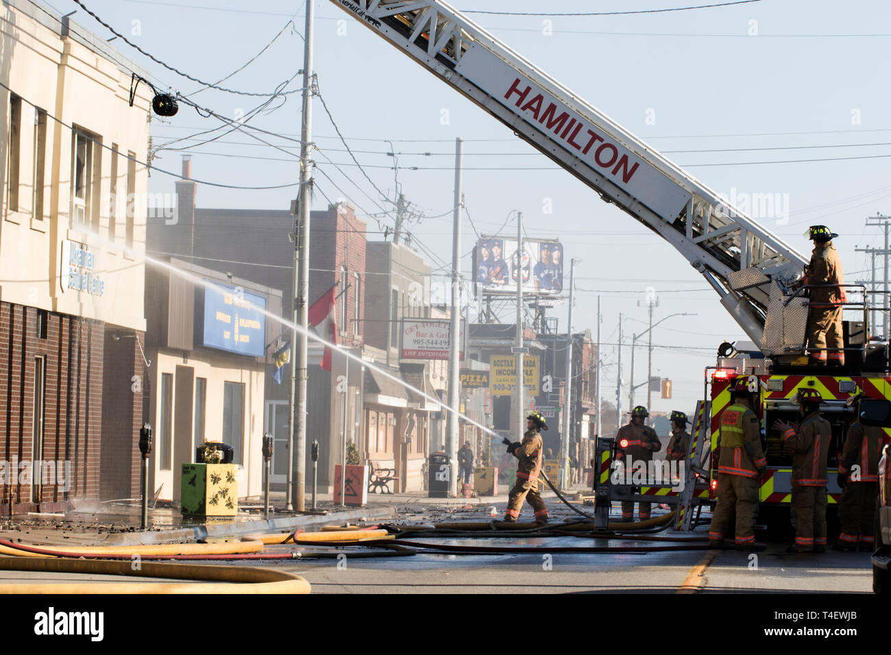 Ontario Canada April 13 2019: Firefighters putting out a building fire ...