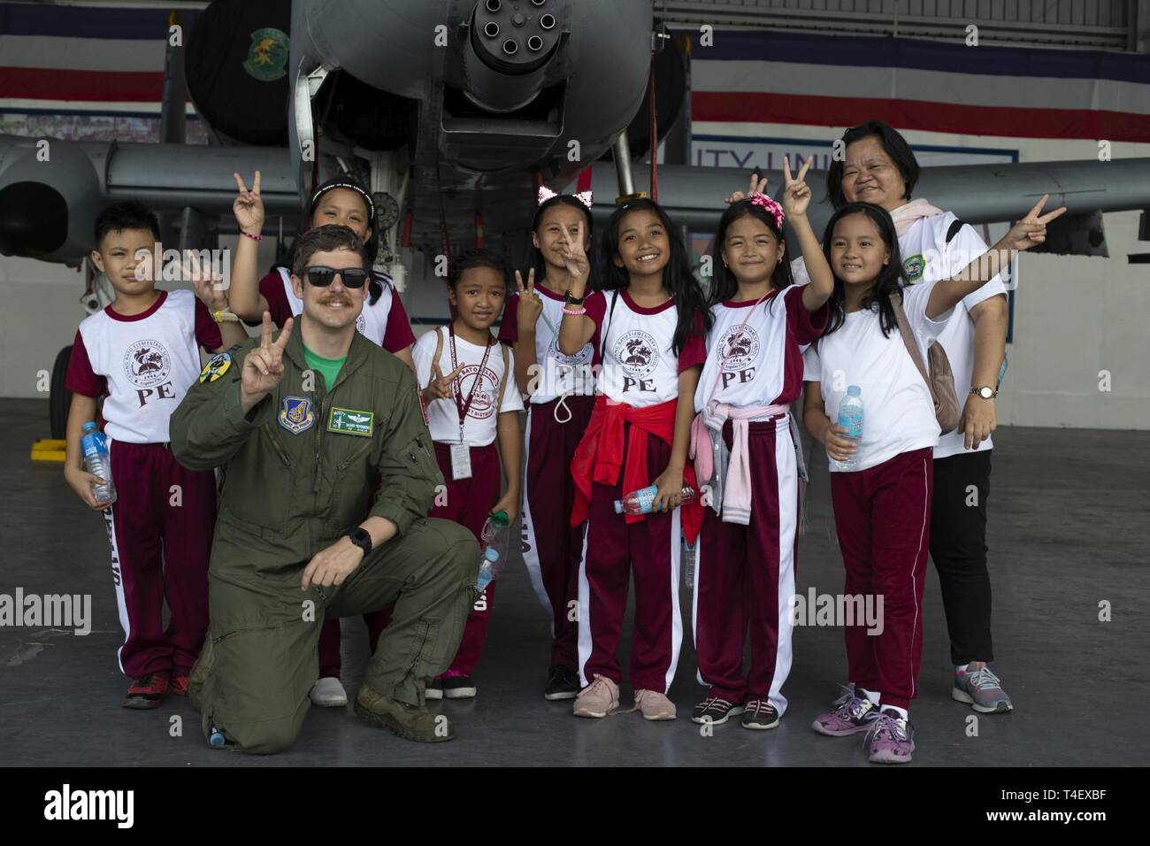 students from sapang bato elementary school and us air force capt basher piepenbring an a 10 thunderbolt lightning ii pilot with the 25th fighter squadron pose for a photo in front of an a 10 at clark air base philippines april 6 2019 during exercise balikatan balikatan is an annual exercise between the us and the philippines and comes from a tagalog phrase meaning shoulder to shoulder representing the partnership between the two countries the exercise promotes regional security and humanitarian efforts for us allies and partners T4EXBF
