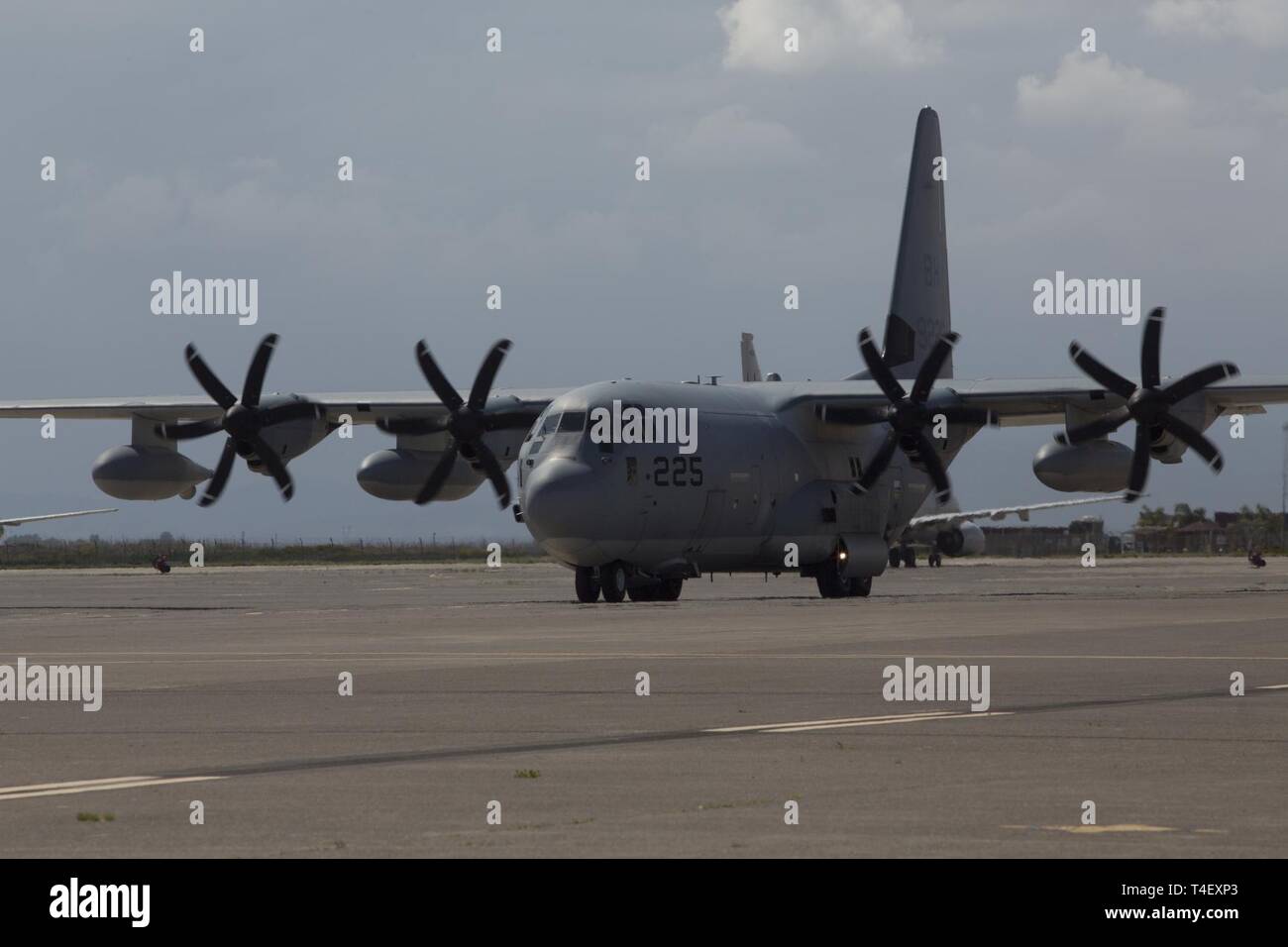 A U.S. Marine Corps KC-130J Super Hercules taxis at Naval Air Station Sigonella, Italy, April 6, 2019. The aircraft transported Marines and equipment with the aviation combat element for Special Purpose Marine Air-Ground Task Force-Crisis Response-Africa 19.2, Marine Forces Europe and Africa. SPMAGTF-CR-AF provides an autonomous, self-deploying, and highly mobile crisis response force to U.S. AFRICOM. The aircraft is with Marine Aerial Refueler Transport Squadron 252. Stock Photo