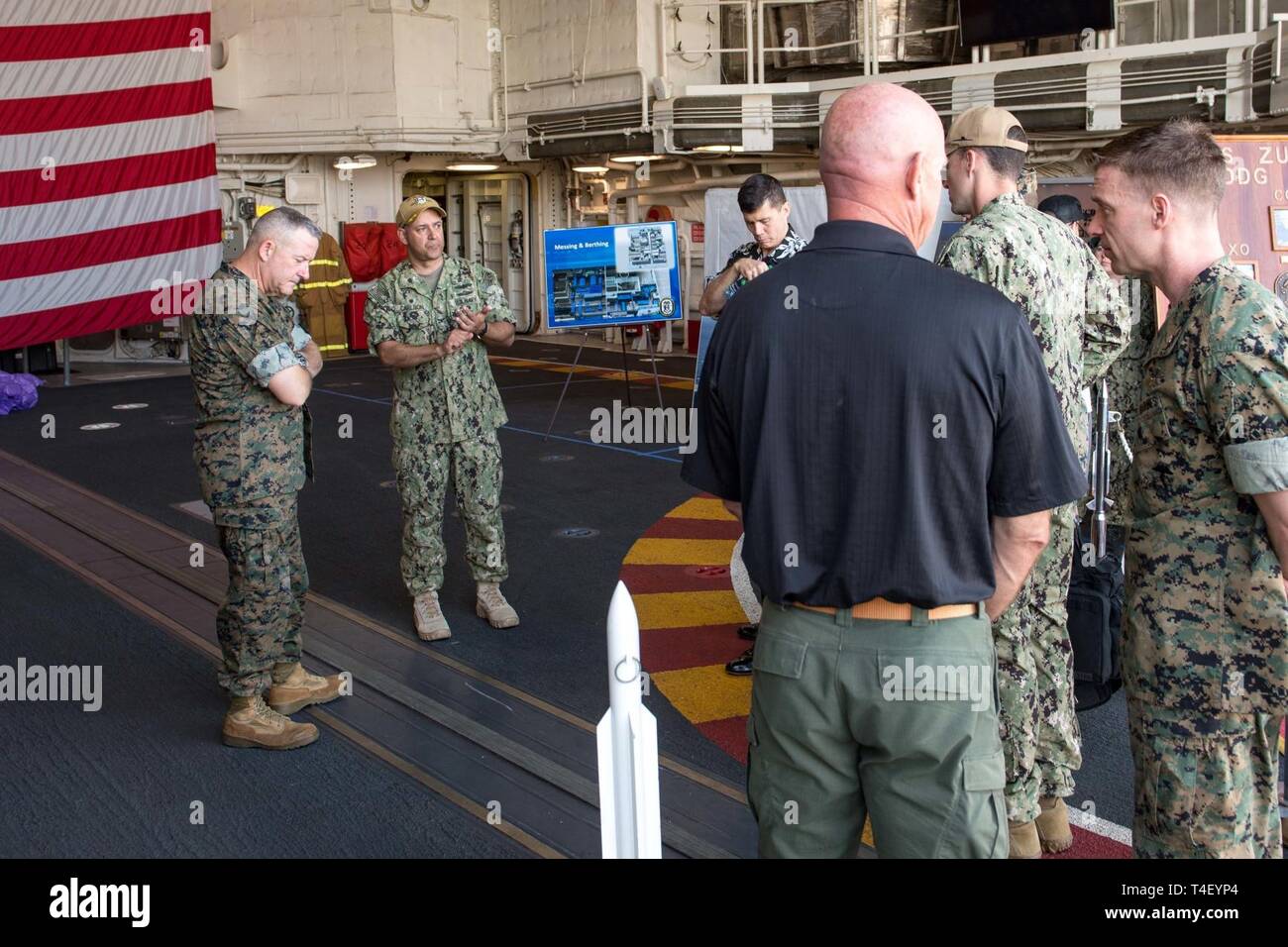 PEARL HARBOR, Hawaii (Apr. 5, 2019) Capt. Carl Andrew Carlson, commanding officer of guided-missile destroyer USS Zumwalt (DDG 1000), speaks during a tour of the ship with Brig. Gen. Robert Sofge, deputy commander, U.S. Marine Corps Forces, Pacific. Zumwalt is conducting the port visit as part of its routine operations in the eastern Pacific. Zumwalt-class destroyers provide the Navy with agile military advantages at sea and with ground forces ashore. Stock Photo