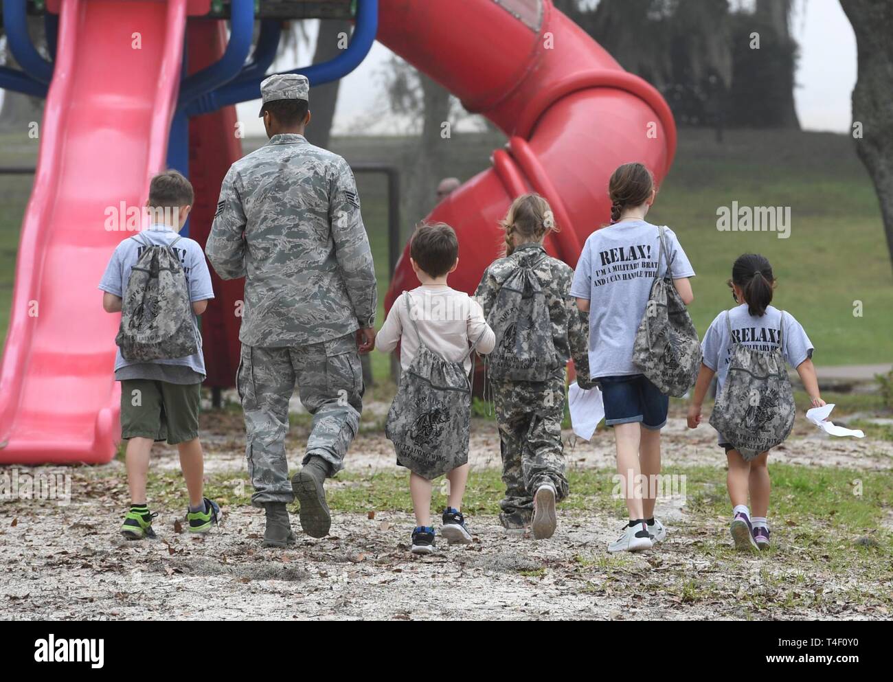 Military children are escorted to the next check list item during ...