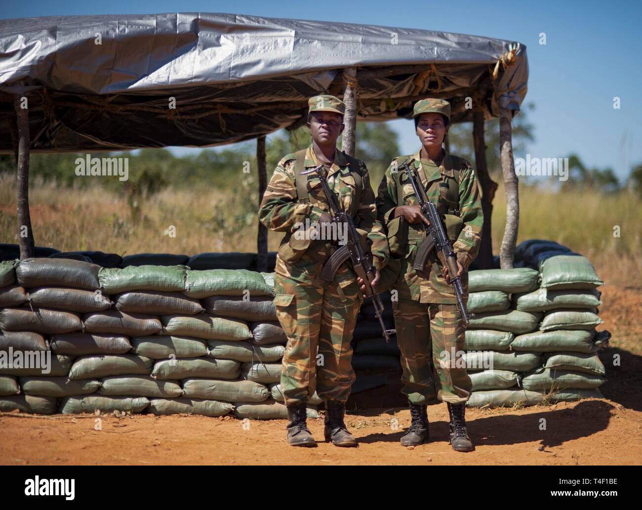 Two Zambian soldiers pose during a field training exercise in