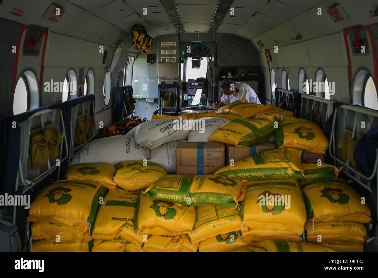 The World Food Programme, the food-assistance branch of the United Nations, transports relief supplies by helicopter from Beira Airport to Bebedo, Mozambique, April 8, 2019, during humanitarian relief efforts in the Republic of Mozambique and surrounding areas following Cyclone Idai. Teams from Combined Joint Task Force-Horn of Africa, which is leading U.S. Department of Defense support to relief efforts in Mozambique, began immediate preparation to respond following a call for assistance from the U.S. Agency for International Development’s Disaster Assistance Response Team. Stock Photo