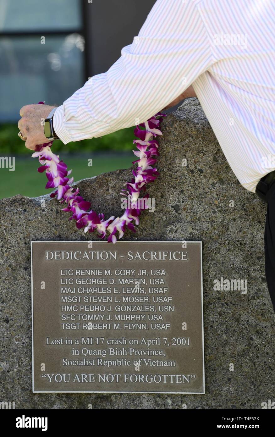 Johnie E. Webb, deputy director, Outreach and Communications directorate, Defense POW/MIA Accounting Agency (DPAA), places a wreath on a memorial commemorating personnel lost during joint recovery operations in Vietnam at Joint Base Pearl-Harbor, Hickam, Hawaii, April 8, 2019. On April 7, 2001, a catastrophic Mi-17 helicopter crash in Vietnam, attributed to inclement weather, took the lives of seven American service members and nine Vietnamese partners who were conducting a mission in Quang Binh Province. DPAA held memorial ceremonies at its facilities in Hawaii and Hanoi to honor their sacrif Stock Photo