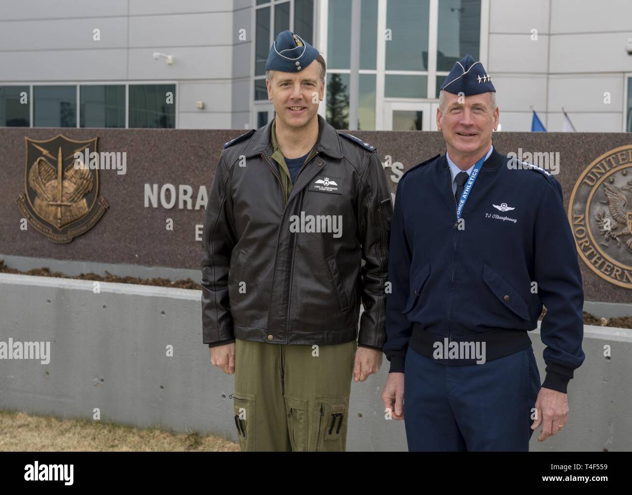 U.S. Air Force Gen. Terrence J. O'Shaughnessy, Commander, North American Aerospace Defense Command and U.S. Northern Command and Royal Canadian Air Force Commander, Lieutenant-General Al Meinzinger stop for a photo in front of the Commands headquarters in Colorado Springs, Colorado, April 9, 2019. Lieutenant-General Meinzinger's visit is to discuss NORAD modernization efforts and the strong relationship between the RCAF and NORAD. Stock Photo