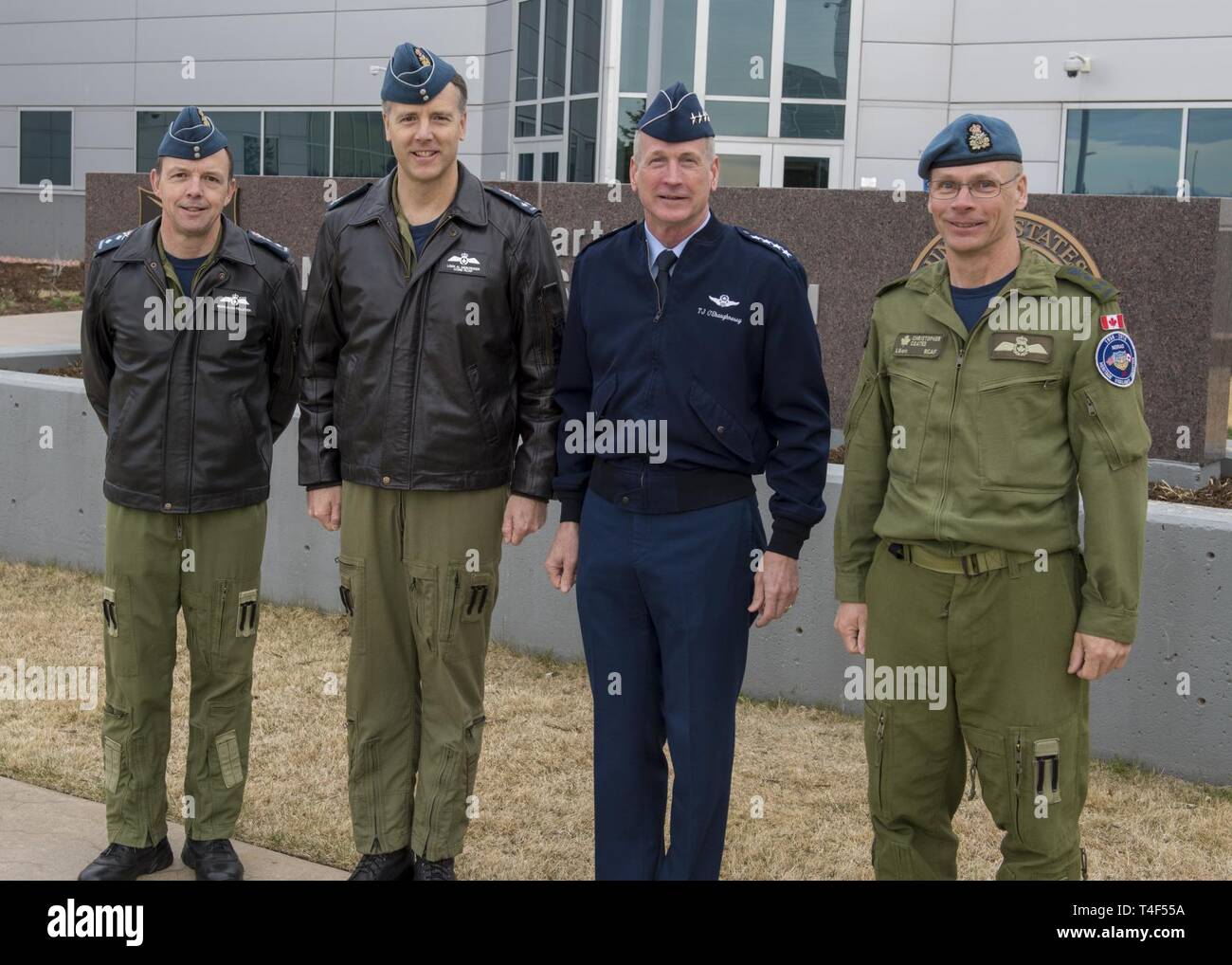 U.S. Air Force Gen. Terrence J. O'Shaughnessy, Commander, North American Aerospace Defense Command and U.S. Northern Command, Royal Canadian Air Force Commander, Lieutenant-General Al Meinzinger and the NORAD Deputy Commander, Royal Canadian Air Force Lieutenant-General Christopher Coatesstop for a photo in front of the Commands headquarters in Colorado Springs, Colorado, April 9, 2019. Lieutenant-General Meinzinger's visit is to discuss NORAD modernization efforts and the strong relationship between the RCAF and NORAD. Stock Photo