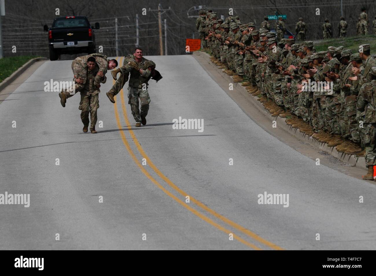 U.S. Army Sappers carry their teammates during the 13th Annual Lt. Gen