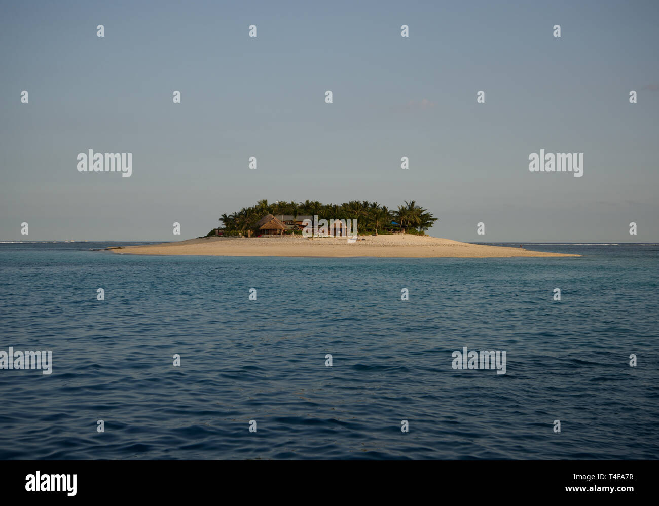 small tropical island surrounded by water Stock Photo Alamy