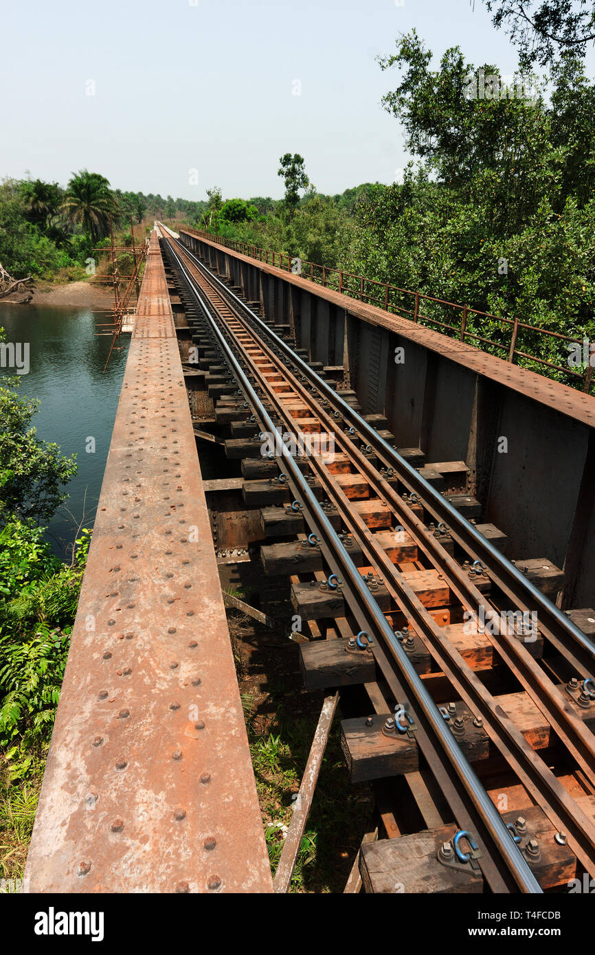 Rail and port operations for managing and transporting iron ore. Rail bridge over river near Port Loko undergoing overhaul and refurbishment Stock Photo