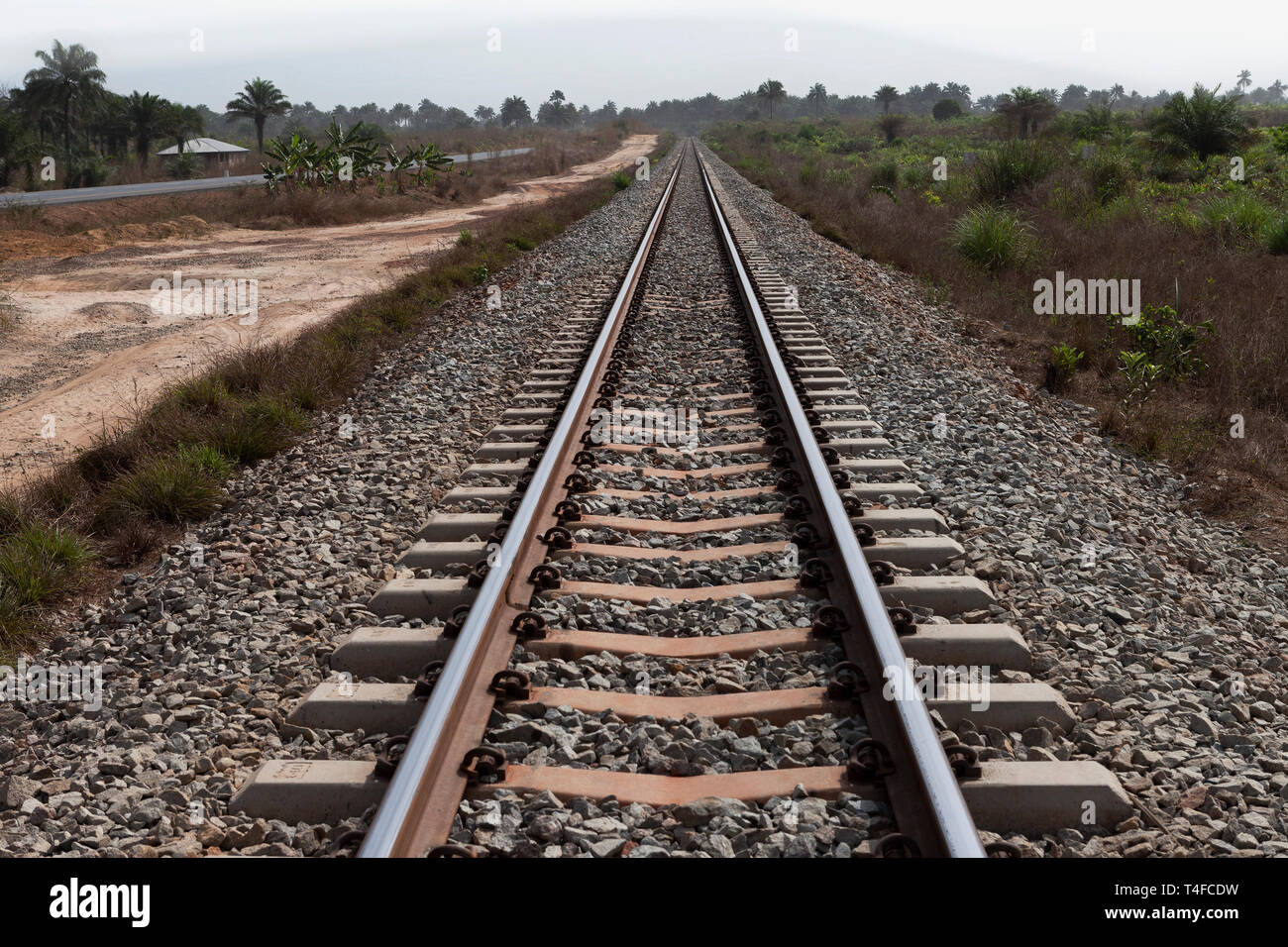 Rail & port operations for managing & transporting iron ore. Straightened and tampered rail track line curve - so cutting down ore train travel time. Stock Photo