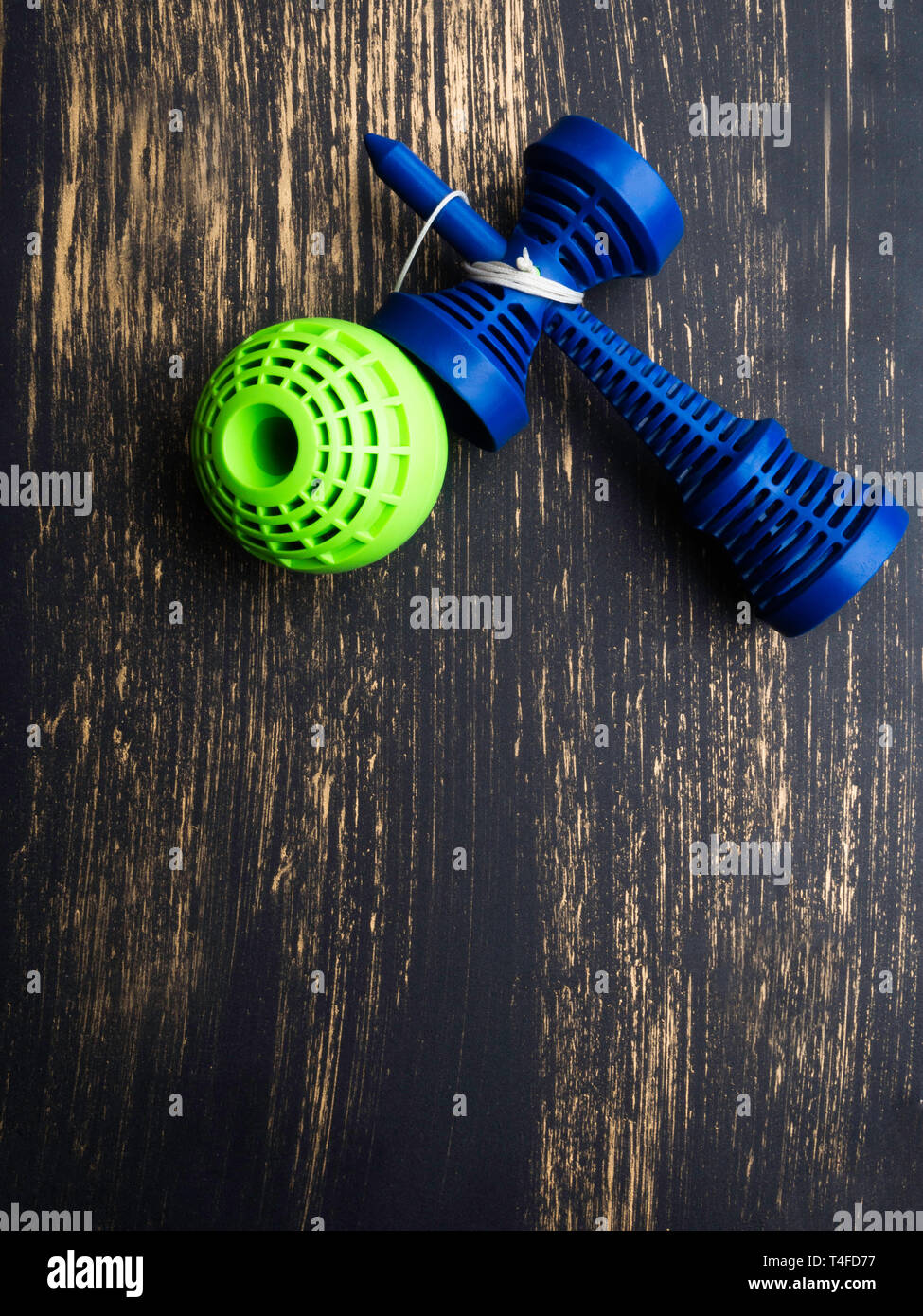 Kendama japanese toy, ball and rope, blue and green Stock Photo Alamy
