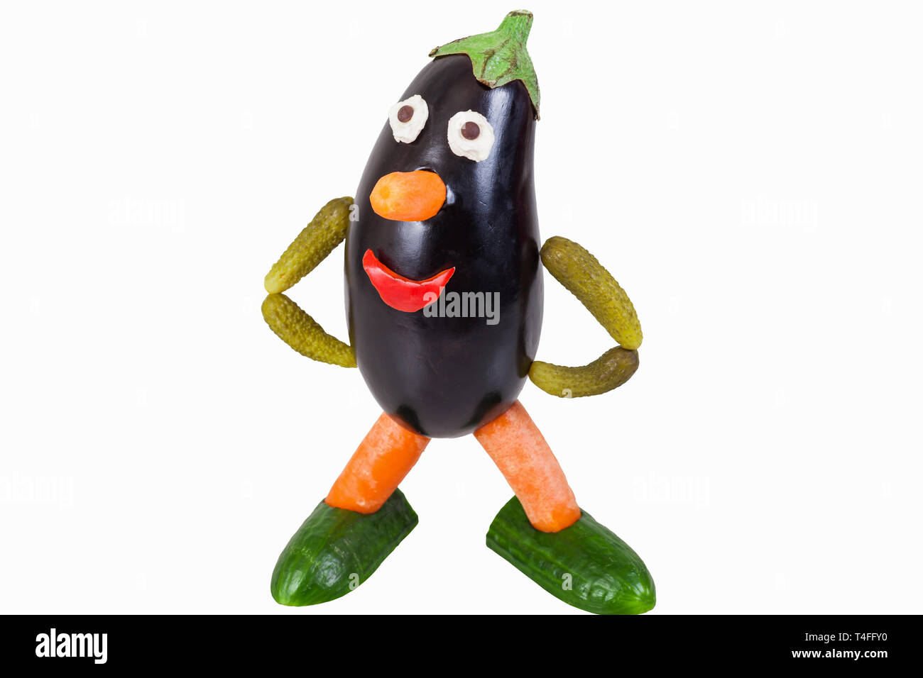 Funny figure carved out of an aubergine - isolated Stock Photo