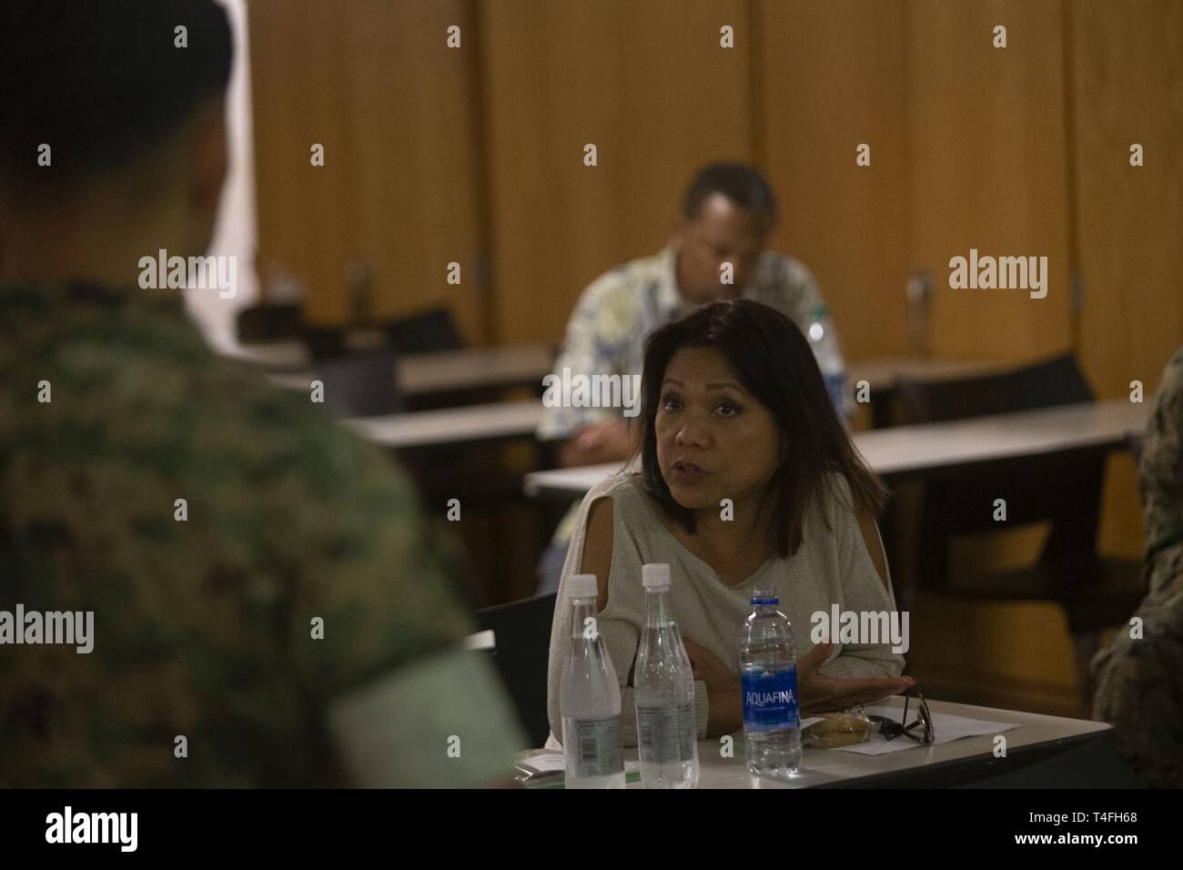 U.S. Marine Corps Col. Raul Lianez, left, commanding officer, Marine Corps Base Hawaii, speaks with Rep. Rida Arakawa, right, of Hawaii's Ewa District, Pu’uloa Range Training Facility, Marine Corps Base Hawaii (MCBH), Apr. 8, 2019.  During the visit, MCBH leadership discussed and showcased Marine Corps marksmanship training, community partnerships, and the positive economic impact from MCBH facilities and service members. Stock Photo