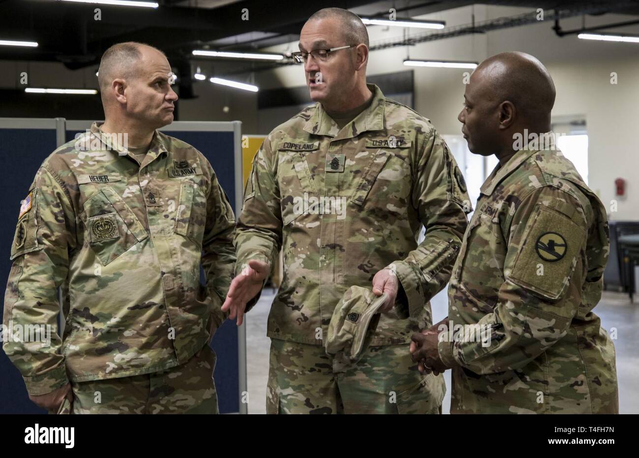 Command Sgt. Maj. Ted L. Copeland, the command sergeant major for the U.S.  Army Reserve, talks to Sgt. Maj. David J. Heuer, the sergeant major for  Operation Cold Steel, and Sgt. Maj.