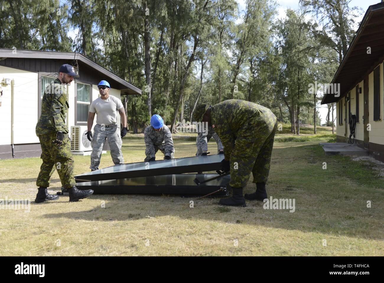 Airmen Of The 103rd Civil Engineer Squadron Work Alongside Their