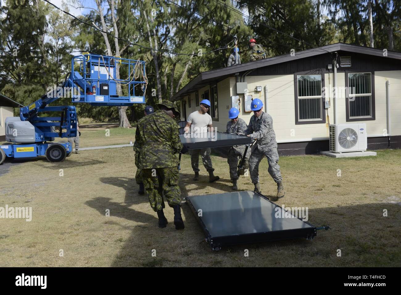 Airmen Of The 103rd Civil Engineer Squadron Work Alongside Their