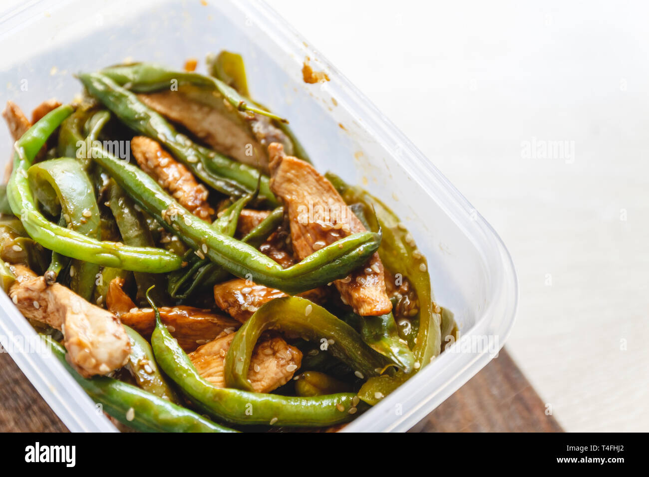 Chicken stew and green beans in plastic ovens for cold storage or