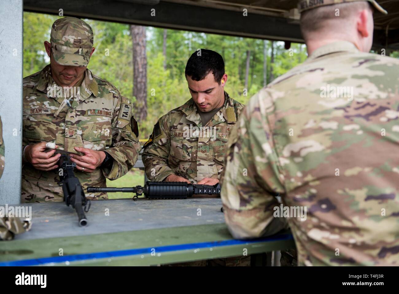 U S Air Force Master Sgt Sean Deam Charlie Flight Chief And Staff Sgt Marcos Silverio Mark Their Weapons In Preparation For The Best Ranger Competition April 9 2019 At Fort Benning Georgia