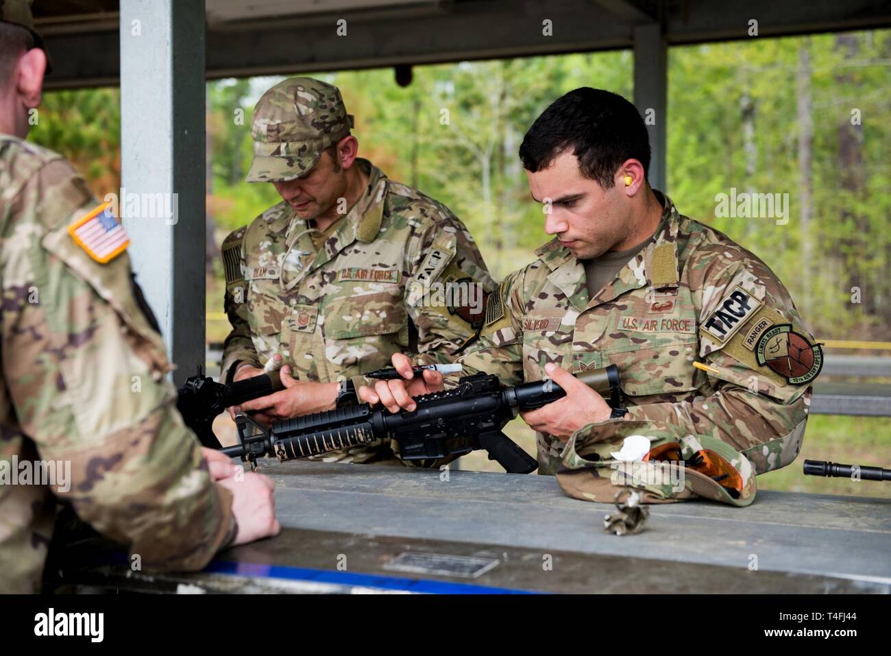 U S Air Force Master Sgt Sean Deam Charlie Flight Chief And Staff Sgt Marcos Silverio Mark Their Weapons In Preparation For The Best Ranger Competition April 9 2019 At Fort Benning Georgia